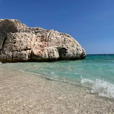 Turquoise water at a rocky cove on the Baunei coast