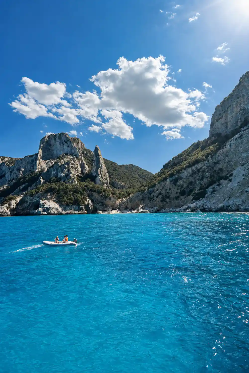 Rocky pinnacles in turquoise water with boats