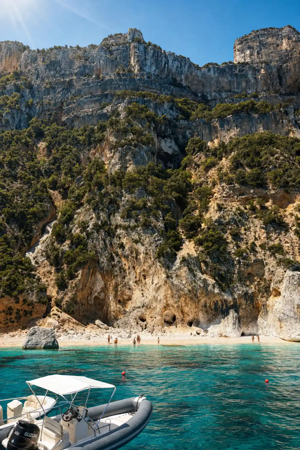 Steep limestone cliffs with vegetation and small beach