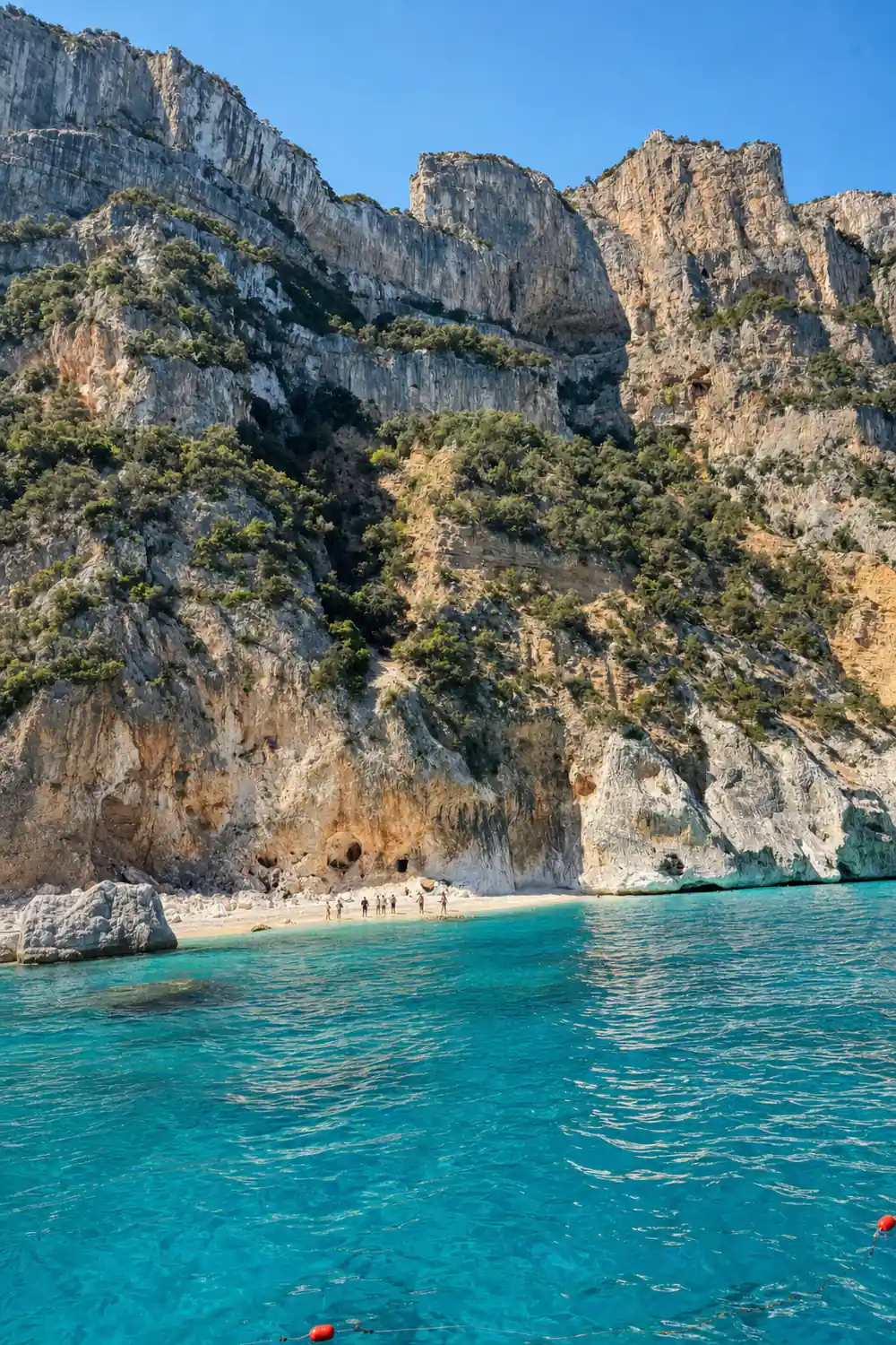 Tall white limestone cliffs with sandy beach below